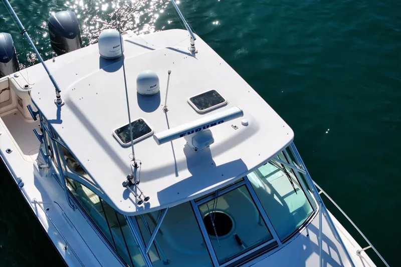 Slide: The Image of 2008 Grady-White Express 360 boat on water, aerial view of deck and cabin. - 24