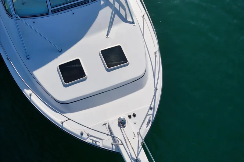 Slide: The Image of 2008 Grady-White Express 360 boat bow on clear water. - 25