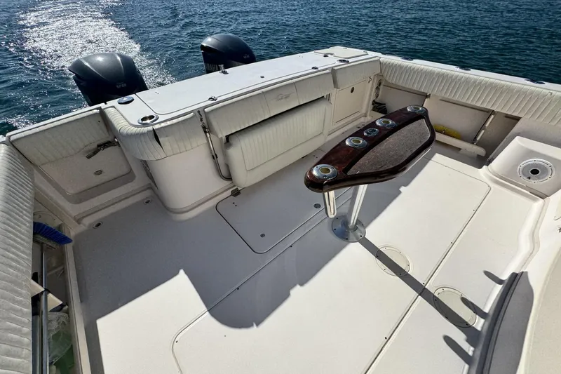 Slide: The Image of 2008 Grady-White Express 360 boat deck with dual engines on water. - 31