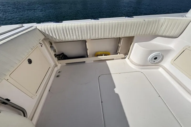 Slide: The Image of 2008 Grady-White Express 360 boat interior with seating and storage compartments. - 32