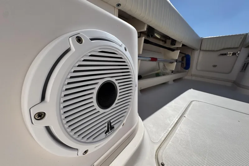 Slide: The Image of 2008 Grady-White Express 360 boat interior with JL Audio speaker and storage compartments. - 33