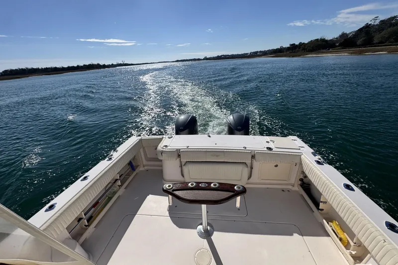 Slide: The Image of 2008 Grady-White Express 360 boat cruising on open water under clear skies. - 34