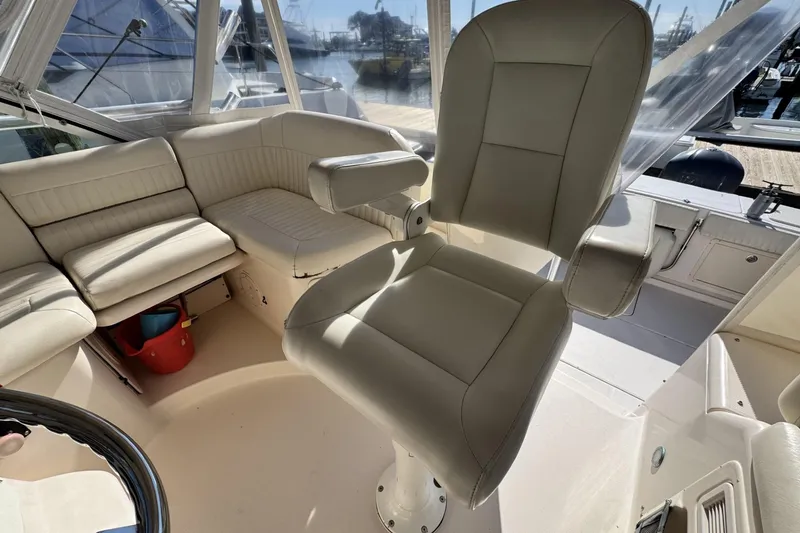 Slide: The Image of 2008 Grady-White Express 360 boat interior with plush seating and helm chair. - 37