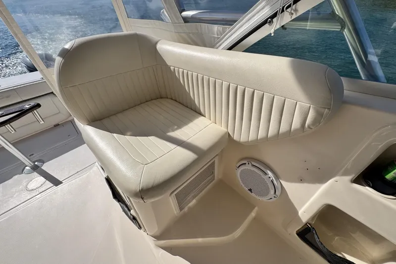 Slide: The Image of 2008 Grady-White Express 360 boat interior with beige seating and speaker. - 38
