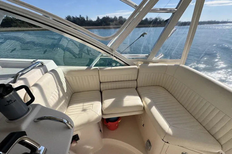 Slide: The Image of 2008 Grady-White Express 360 boat interior with cream seating and ocean view. - 41