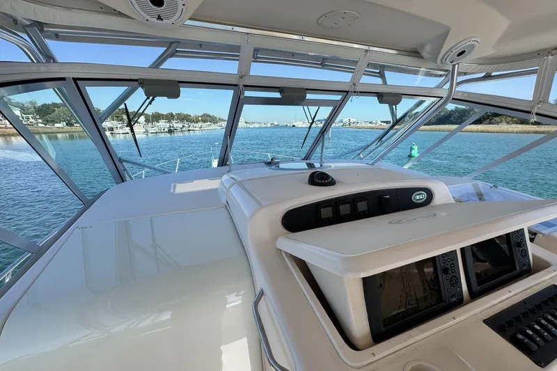 Slide: The Image of 2008 Grady-White Express 360 boat interior with navigation equipment on a sunny day. - 44