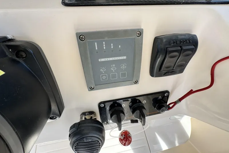Slide: The Image of Control panel of a 2008 Grady-White Express 360 boat with switches and indicators. - 48