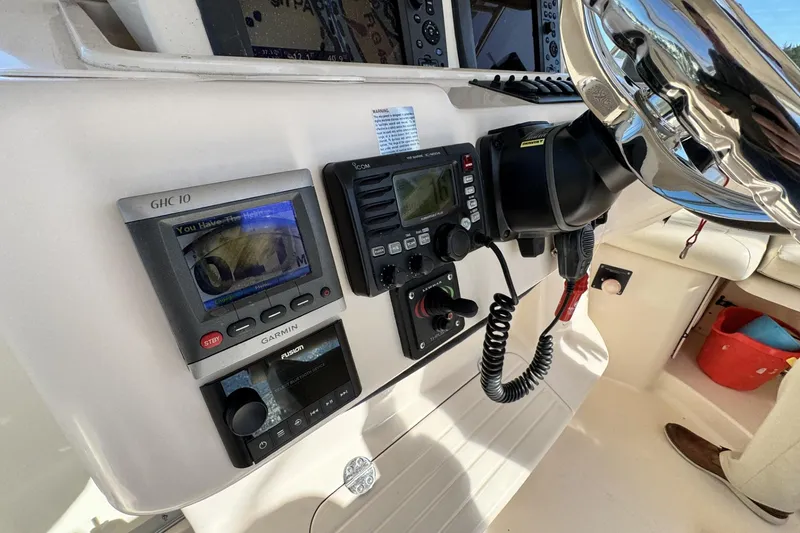 Slide: The Image of 2008 Grady-White Express 360 helm with Garmin and Icom navigation equipment. - 49