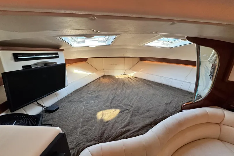 Slide: The Image of 2008 Grady-White Express 360 cabin interior with bed, TV, and skylights. - 51