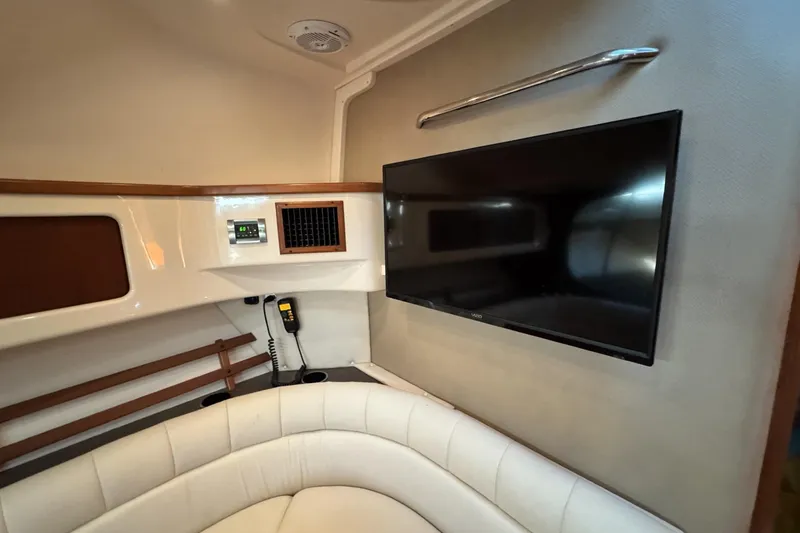 Slide: The Image of Interior of 2008 Grady-White Express 360 boat with TV and seating area. - 54