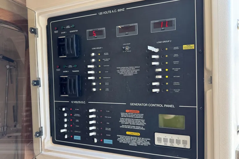 Slide: The Image of Electrical control panel on a 2008 Grady-White Express 360 boat. - 55