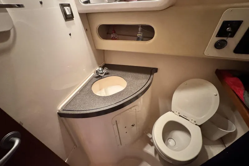 Slide: The Image of 2008 Grady-White Express 360 boat bathroom with sink and toilet. - 57