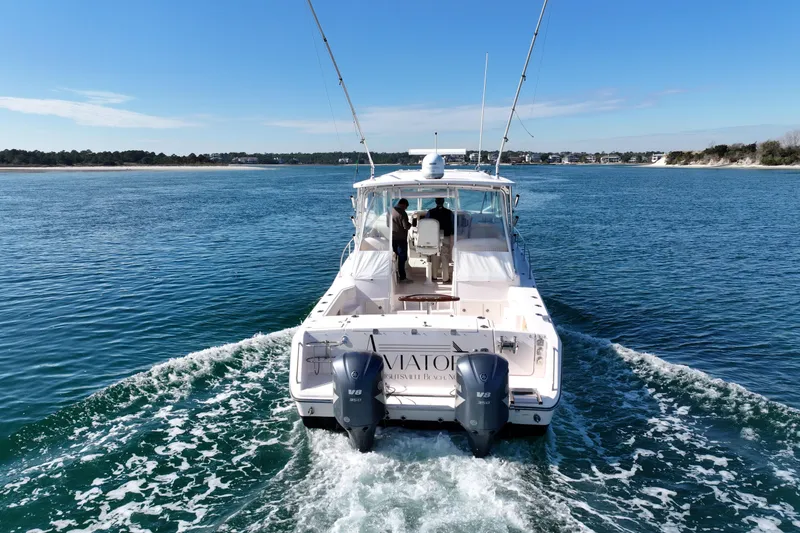 Slide: The Image of 2008 Grady-White Express 360 boat cruising on open water, rear view. - 6