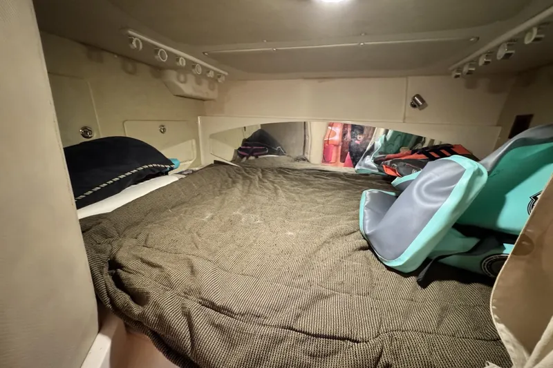 Slide: The Image of Cozy cabin interior of 2008 Grady-White Express 360 with bed and storage. - 65