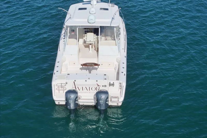 Slide: The Image of 2008 Grady-White Express 360 boat on water, rear view with twin engines. - 8