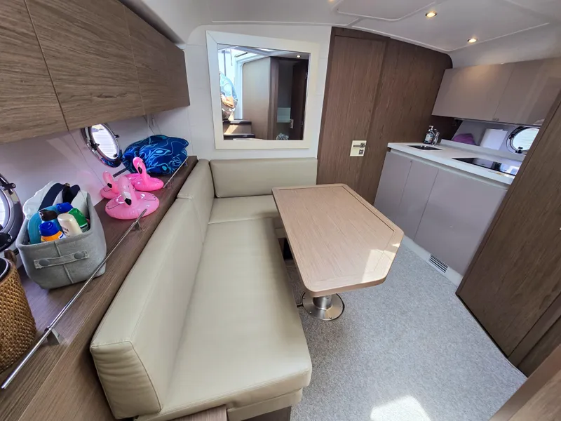 Slide: The Image of Interior of 2019 Beneteau Gran Turismo 40 yacht with seating and kitchenette. - 17