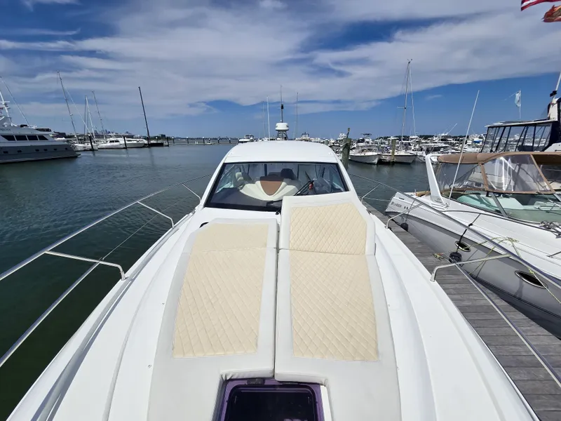 Slide: The Image of 2019 Beneteau Gran Turismo 40 yacht docked at marina under blue sky. - 20
