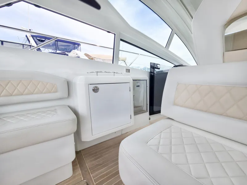 Slide: The Image of Interior of 2019 Beneteau Gran Turismo 40 yacht with white quilted seating. - 6