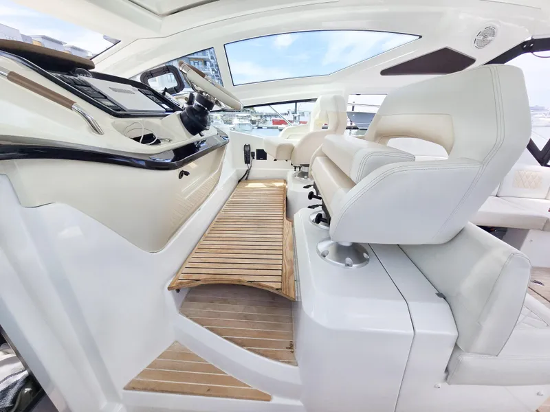 Slide: The Image of 2019 Beneteau Gran Turismo 40 cockpit with modern helm and luxurious seating. - 7