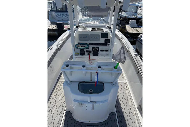 Slide: The Image of 2013 Sea Hunt Gamefish 25 boat interior with Garmin electronics and fishing gear. - 2