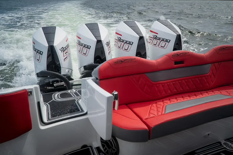 Slide: The Image of 2024 MTI V42 boat with four powerful Racing 500 engines and red seating. - 9