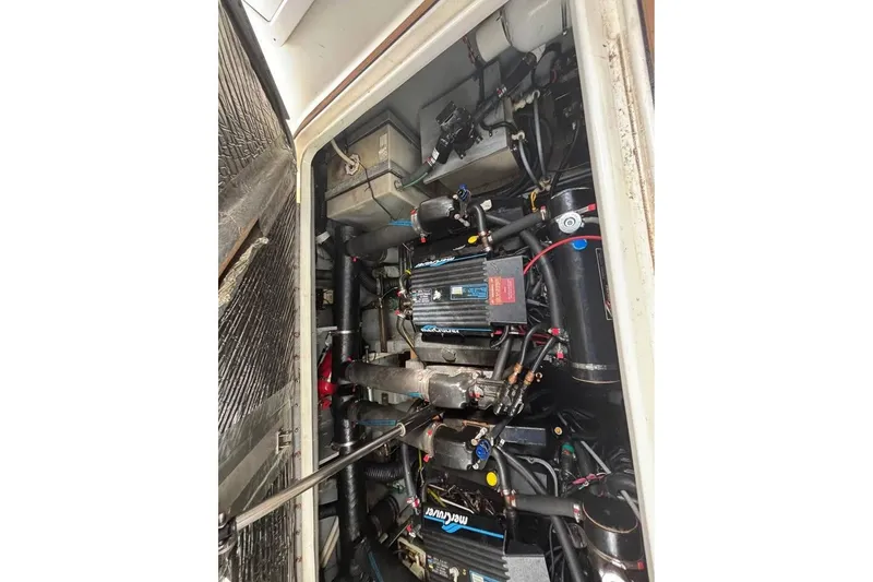 Slide: The Image of Engine compartment of a 1996 Sea Ray 330 Sundancer boat, showing detailed components. - 9