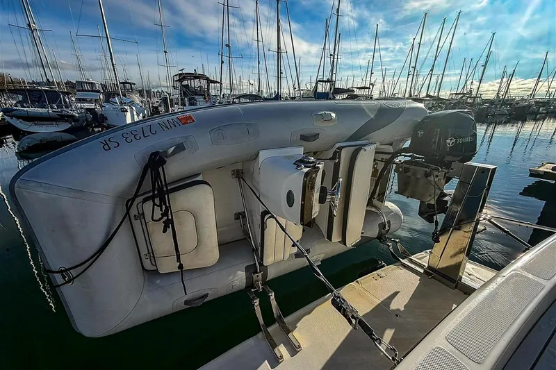 Slide: The Image of 2002 Bayliner 3988 Command Bridge Motoryacht with dinghy and Tohatsu outboard motor. - 34