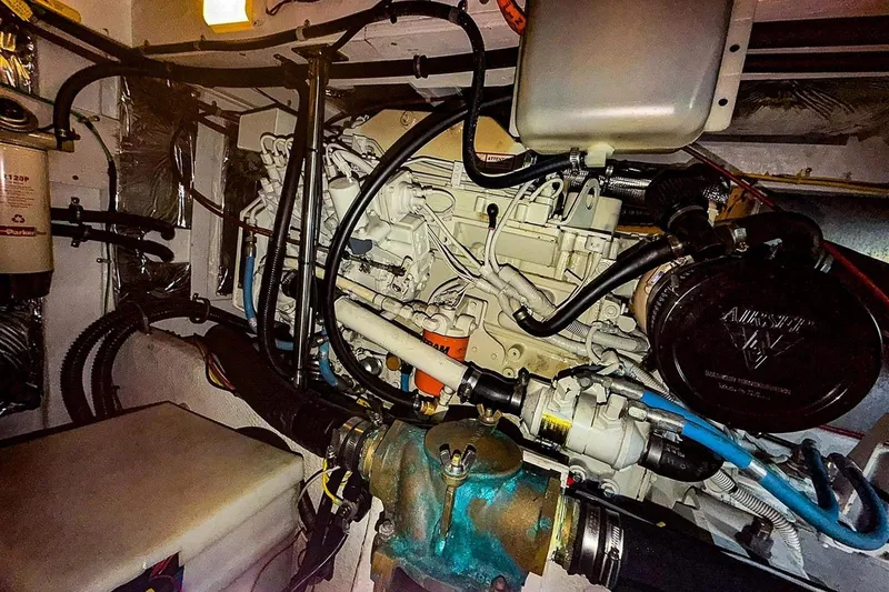 Slide: The Image of Engine room of 2002 Bayliner 3988 Command Bridge Motoryacht, showcasing complex machinery and components. - 39