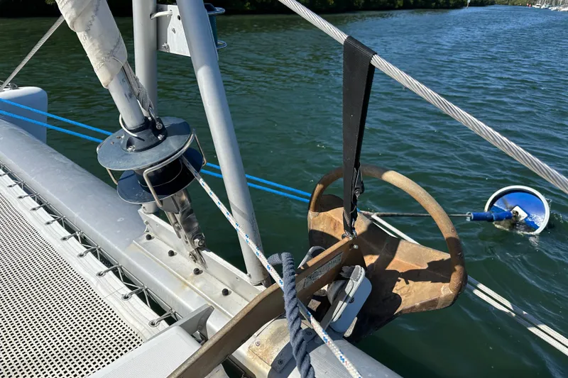 Slide: The Image of Sailboat deck with anchor and rigging, Lagoon 410-S2, 2006 model, on calm water. - 26