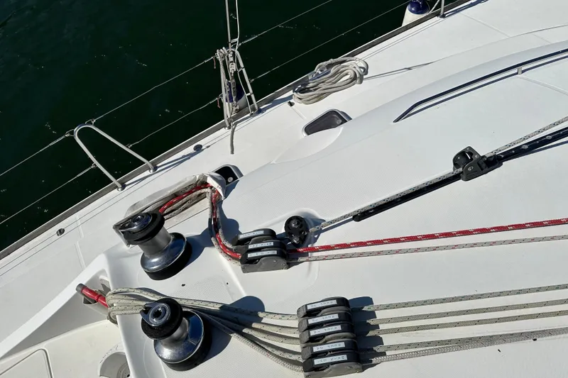 Slide: The Image of Deck view of 2006 Lagoon 410-S2 sailboat with winches and ropes. - 28