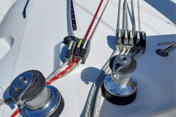 Slide: The Image of Deck of 2006 Lagoon 410-S2 catamaran with winches and ropes. - 29