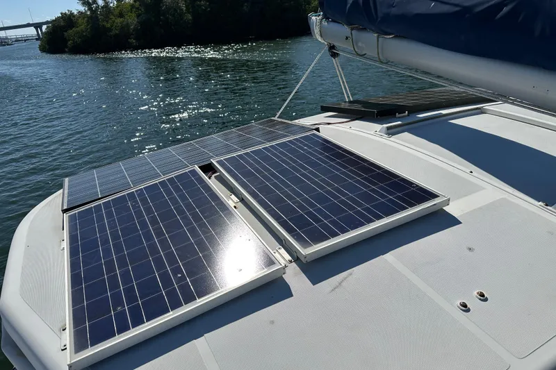 Slide: The Image of Solar panels on a 2006 Lagoon 410-S2 catamaran, harnessing energy on a sunny day. - 35