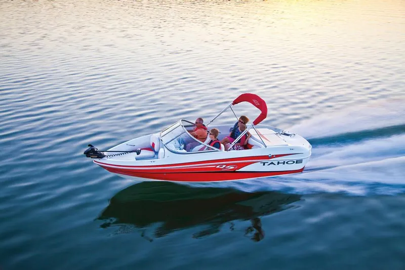 Slide: The Image of Rear view of a 2013 Tahoe Q5 SF boat on a trailer in a parking lot. - 2