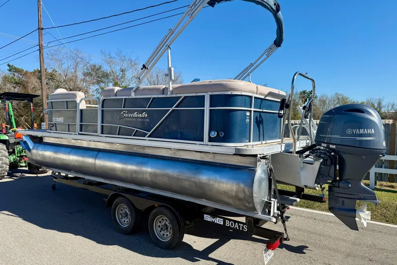 Slide: The Image of 2015 Sweetwater 2286 BF pontoon boat with Yamaha outboard motor on trailer. - 2
