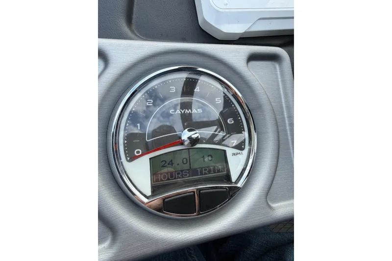 Slide: The Image of Dashboard of 2023 Caymas CX 21 PRO boat showing RPM gauge and digital display. - 10