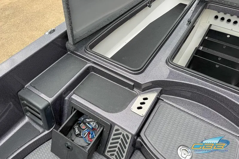 Slide: The Image of 2023 Caymas CX 21 PRO boat storage compartments and deck details. - 22