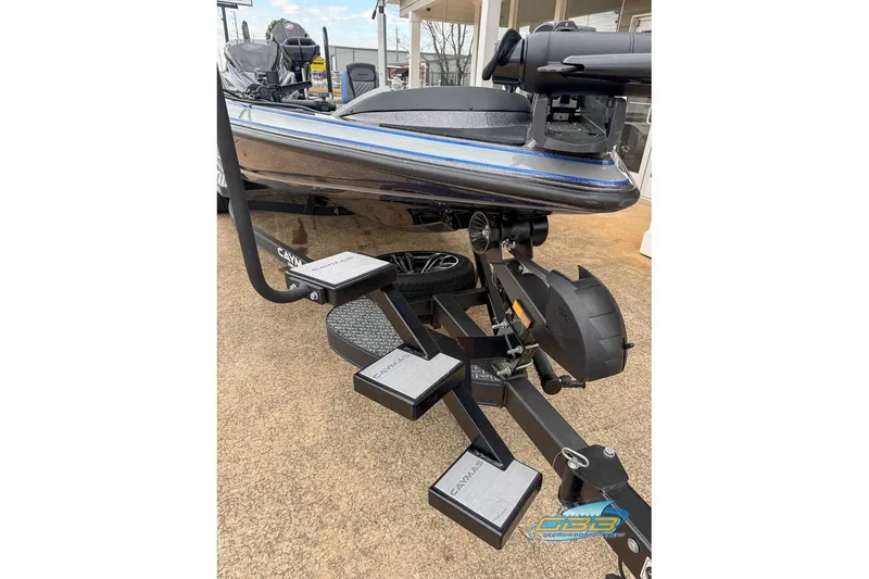 Slide: The Image of 2023 Caymas CX 21 PRO boat on trailer with step ladder, outdoor display. - 23