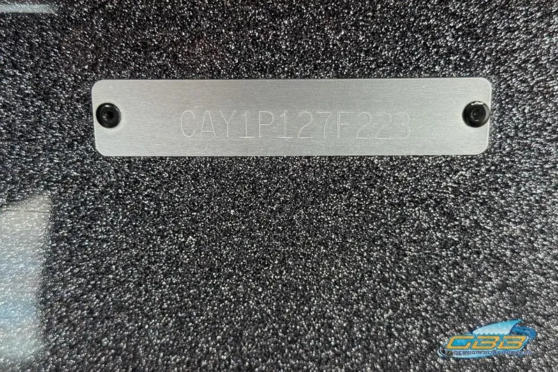 Slide: The Image of 2023 Caymas CX 21 PRO boat identification plate on textured surface. - 32