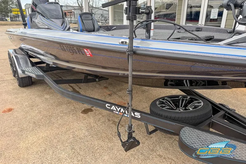 Slide: The Image of 2023 Caymas CX 21 PRO boat on trailer, displayed outdoors. - 4