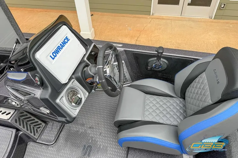 Slide: The Image of 2023 Caymas CX 21 PRO boat cockpit with Lowrance display and cushioned seat. - 8