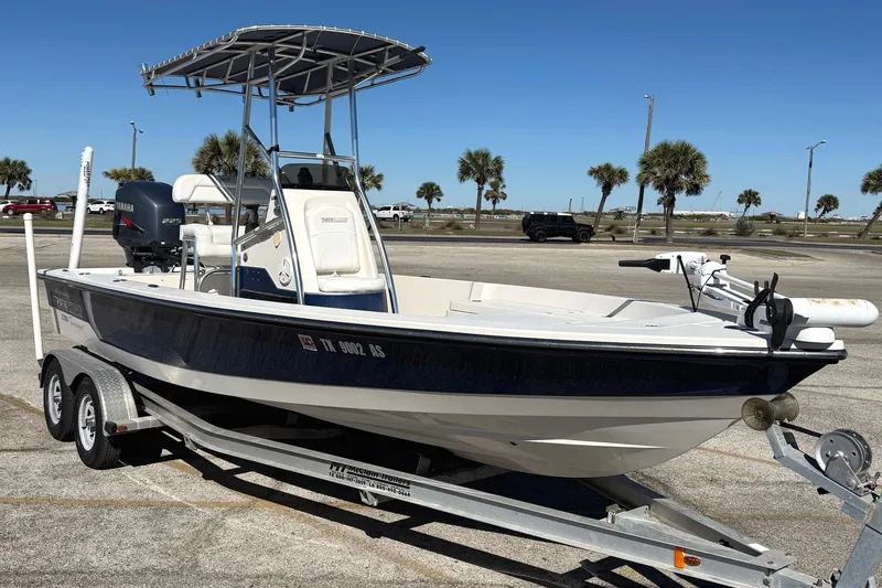 Slide: The Image of 2008 Pathfinder 2200 Tournament Edition boat on trailer, parked in sunny lot. - 0