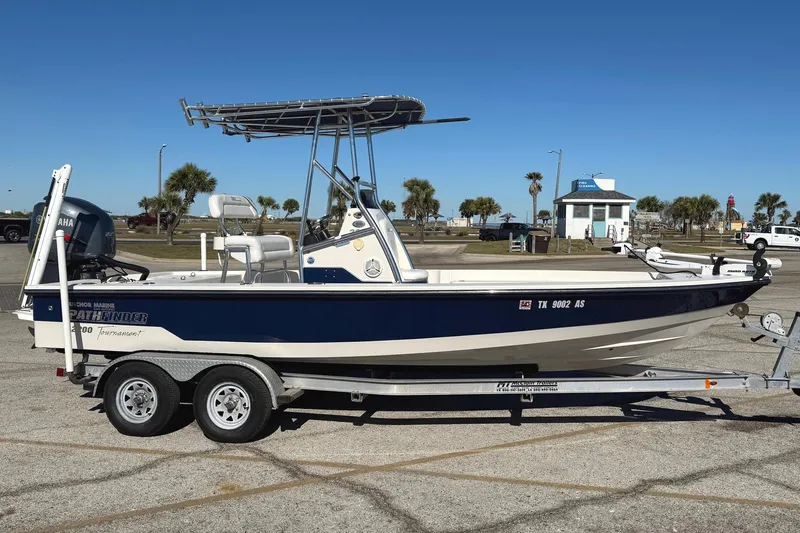 Slide: The Image of 2008 Pathfinder 2200 Tournament Edition boat on trailer, parked in sunny lot. - 1