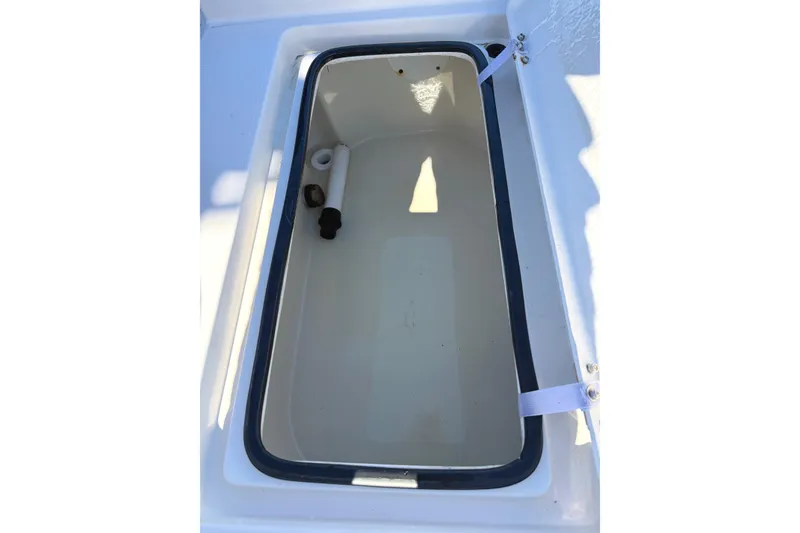 Slide: The Image of Open storage compartment on 2008 Pathfinder 2200 Tournament Edition boat. - 14