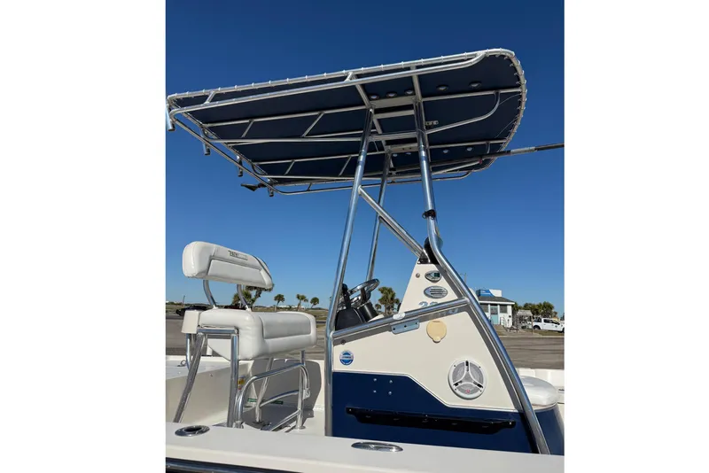 Slide: The Image of 2008 Pathfinder 2200 Tournament Edition boat with T-top and seating, under clear blue sky. - 5