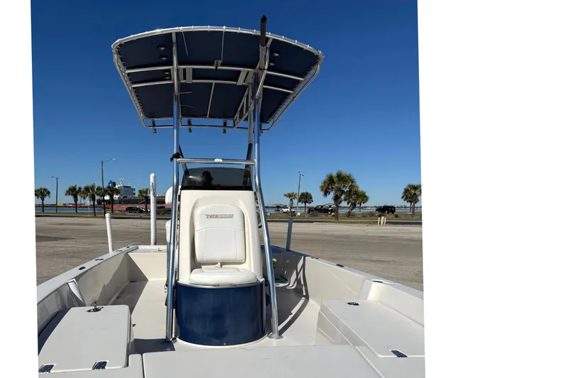 Slide: The Image of 2008 Pathfinder 2200 Tournament Edition boat with T-top, docked under clear blue sky. - 7