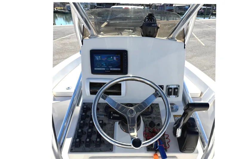 Slide: The Image of 2008 Pathfinder 2200 Tournament Edition boat console with steering wheel and navigation system. - 9
