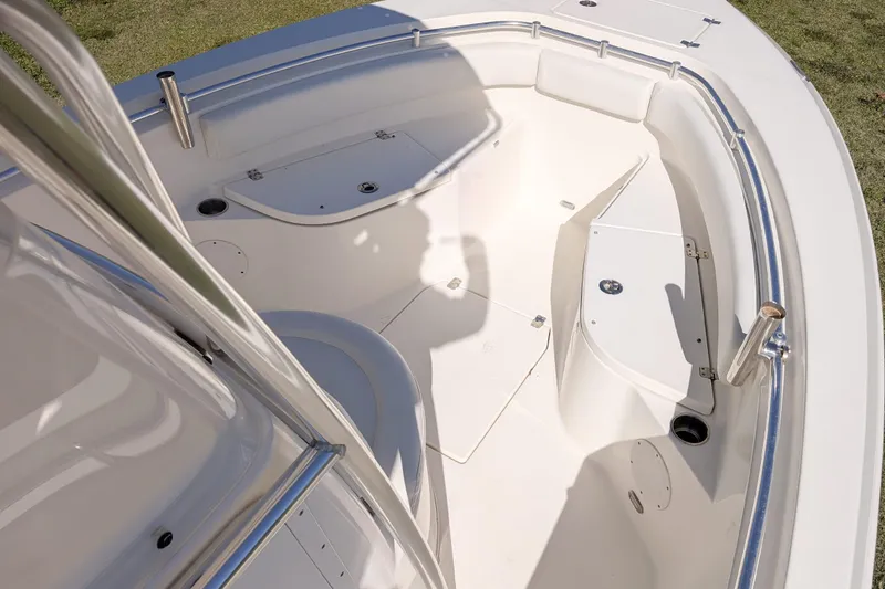 Slide: The Image of 2019 Cobia 237 Center Console boat interior with seating and storage compartments. - 11
