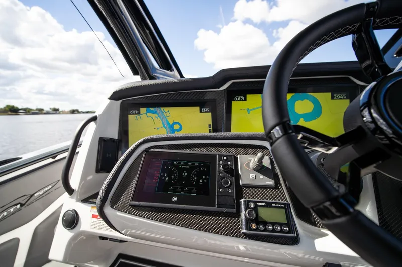 Slide: The Image of MTI V42 2020 boat dashboard with navigation screens and steering wheel. - 16