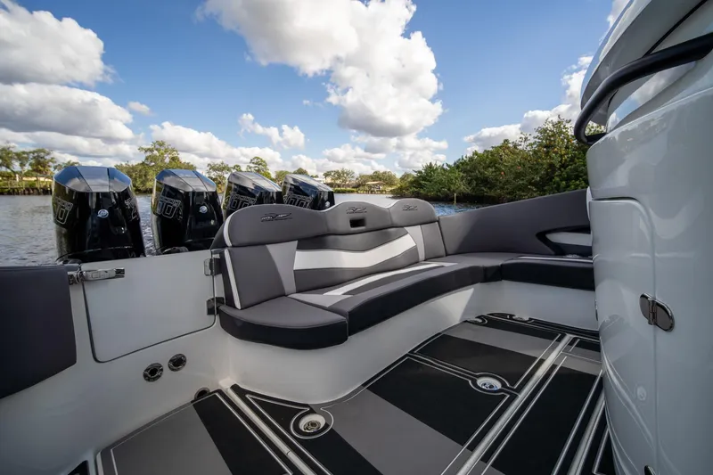 Slide: The Image of Luxury MTI V42 boat interior with seating, 2020 model, featuring multiple outboard engines. - 2