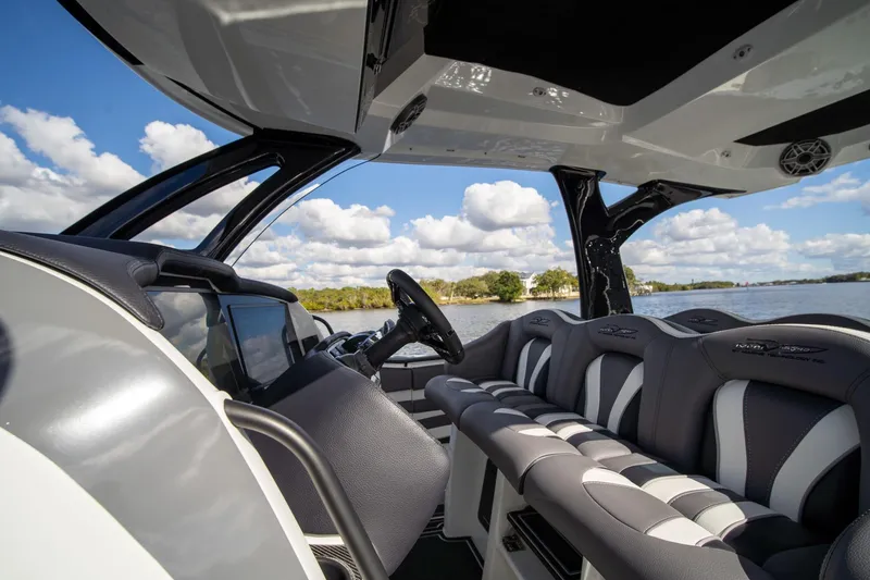Slide: The Image of Luxurious interior of 2020 MTI V42 boat with plush seating and scenic water view. - 21